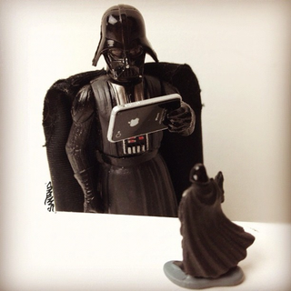 Illustration for article titled Toys Playing with Toy-Size Apple Gadgets Will Make You Either Sneer or Coo